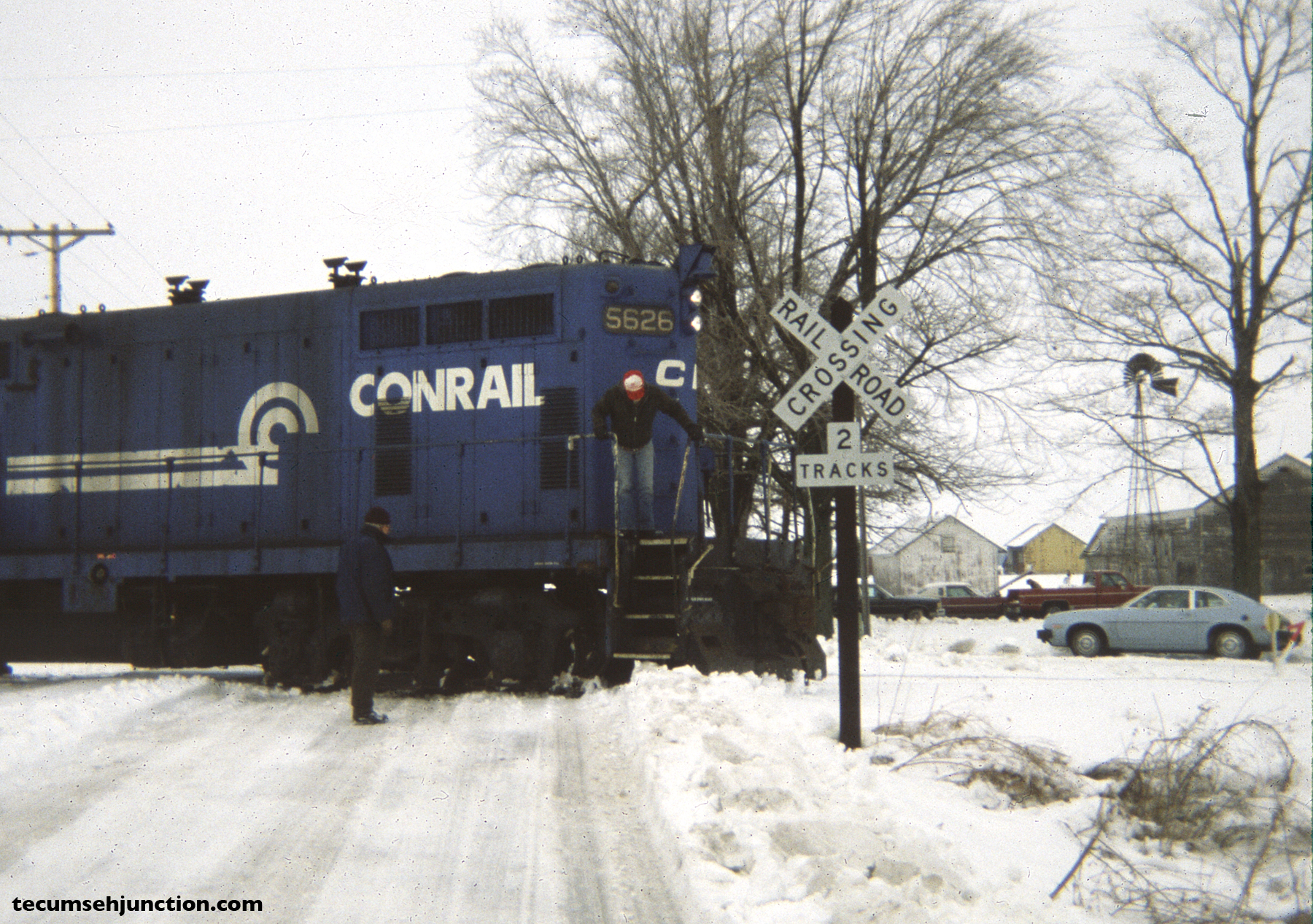 Conrail 5626 enters the former Morenci Branch at Grosvenor, Michigan. Frigid weather and ice meant that special care had to be taken at crossings. (12 December 1981)