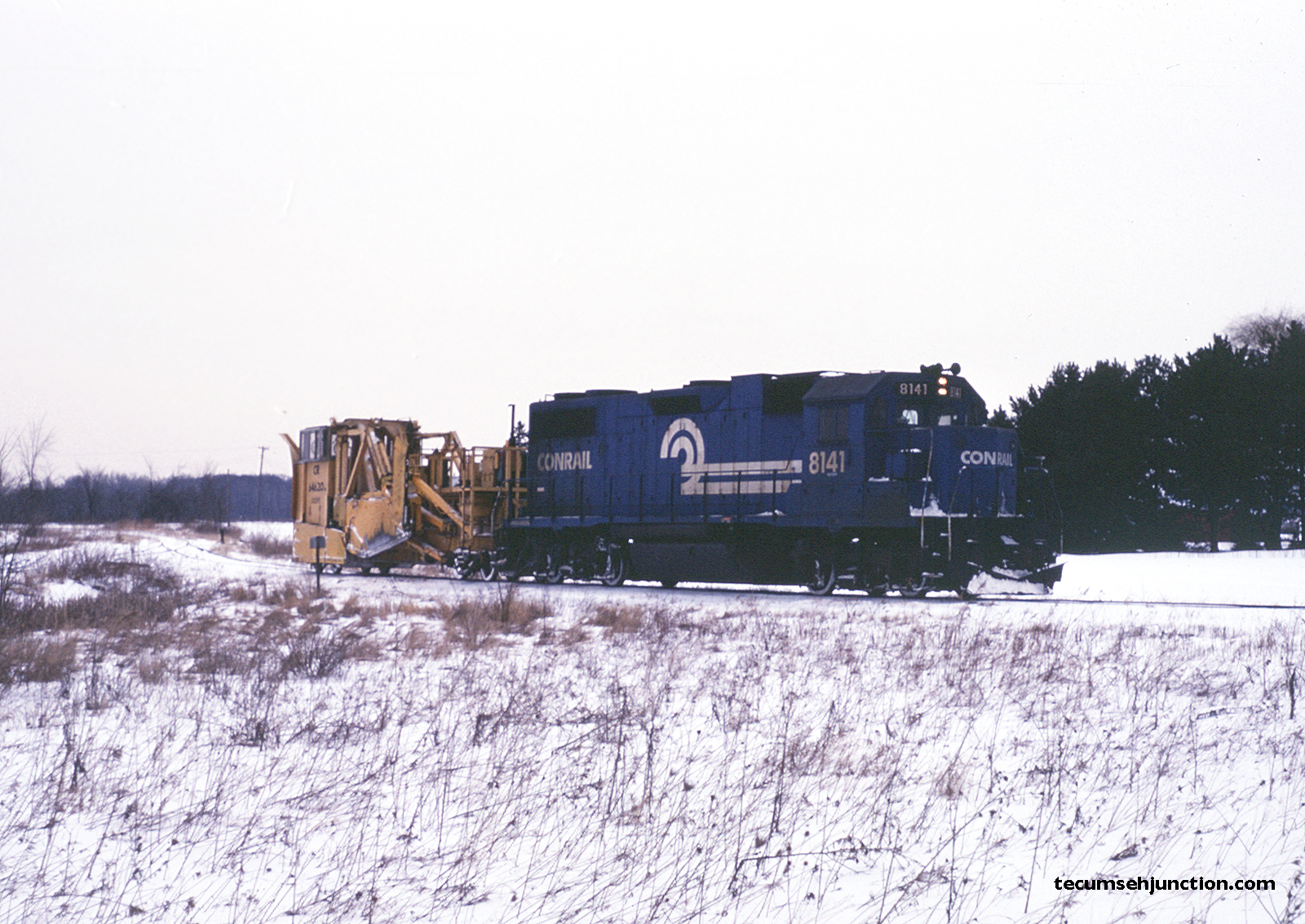 Number 8141 returns to Lenawee Junction, pulling the re-railed spreader. 